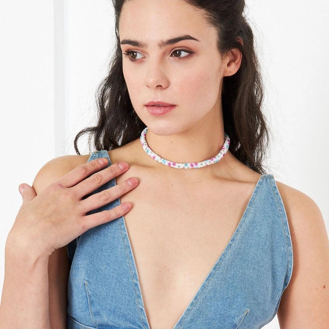 Artisan-crafted green floral necklace featuring vibrant kum beads and intricate crochet detailing, designed for those who appreciate unique jewelry.