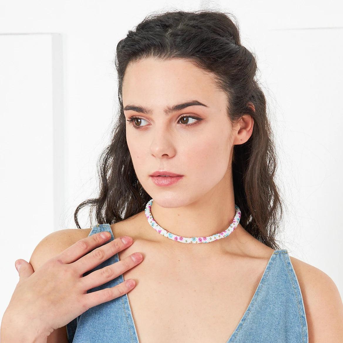 Unique floral necklace crafted from kum beads and crochet, embodying natural beauty and artisan craftsmanship, suitable for any occasion.