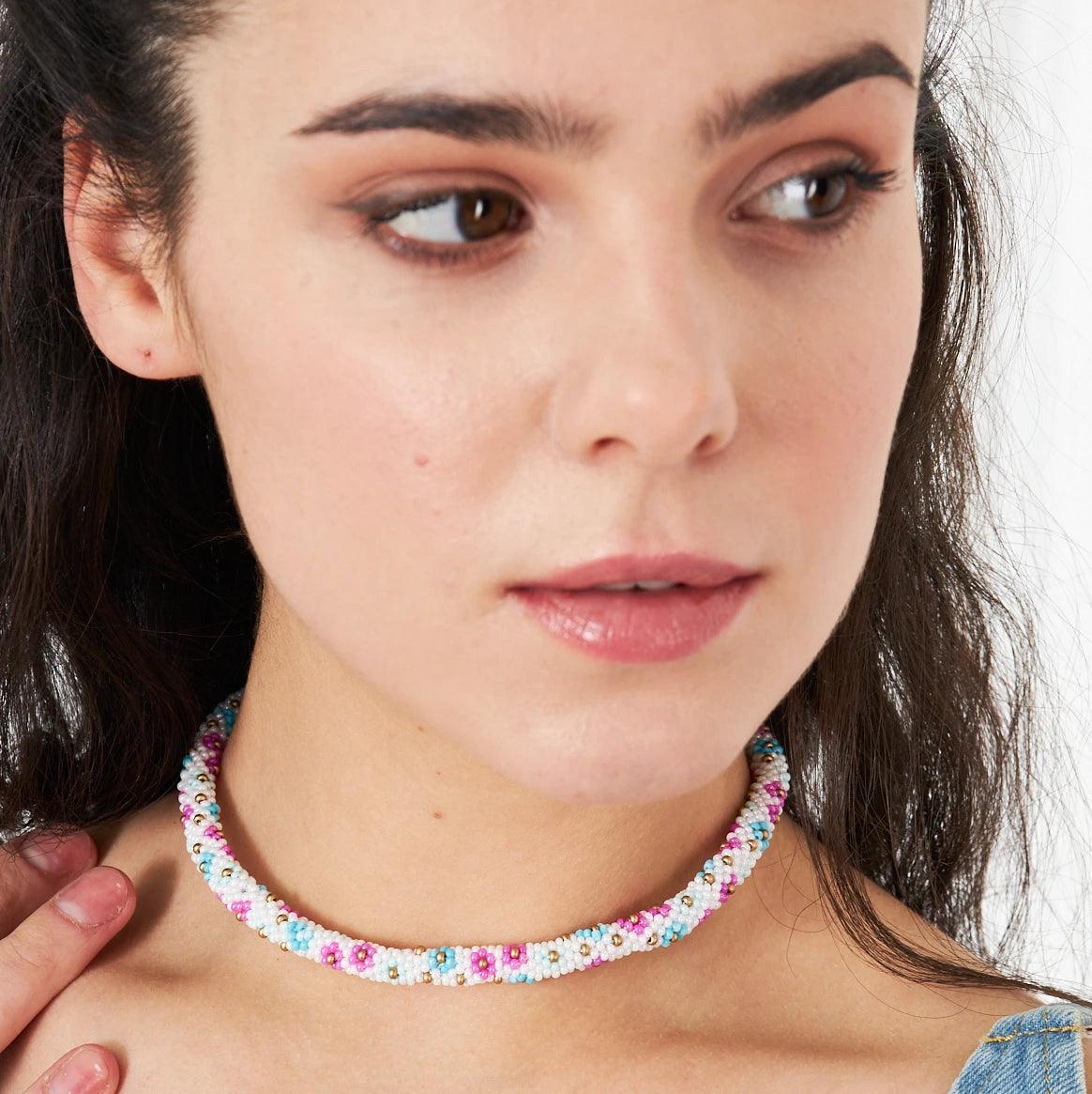 Unique green floral necklace handcrafted with vibrant kum beads and intricate crochet details, embodying natural elegance and bohemian style.
